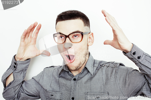 Image of young handsome well-groomed guy posing emotional on white background, lifestyle people concept