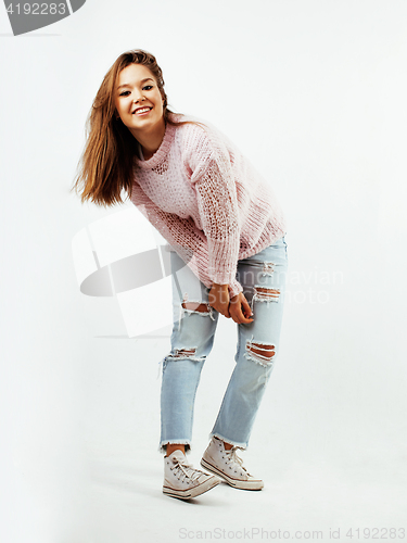 Image of young pretty teenage hipster girl posing emotional happy smiling on white background, lifestyle people concept 