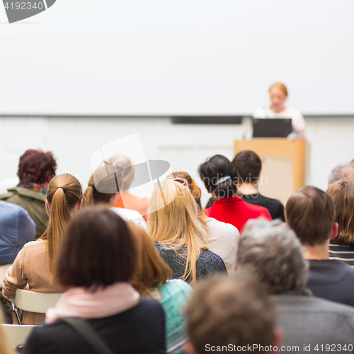 Image of Woman giving presentation on business conference.