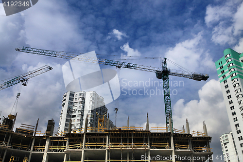 Image of cranes and construction of microdistrict
