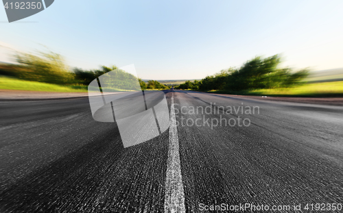 Image of road through the green field