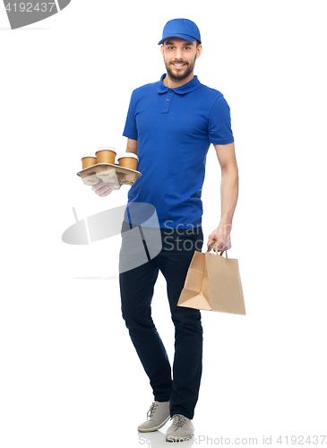 Image of happy delivery man with coffee and food in bag