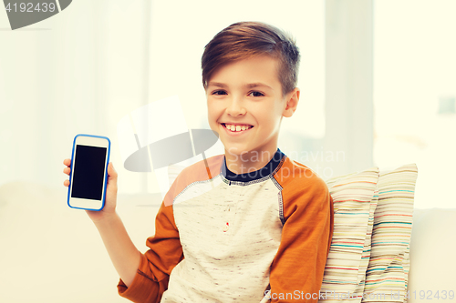 Image of smiling boy with smartphone at home