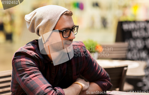 Image of happy smiling man in eyeglasses and hipster hat