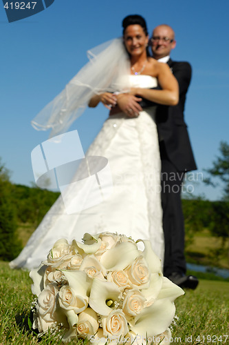 Image of Wedding bouquet and couple