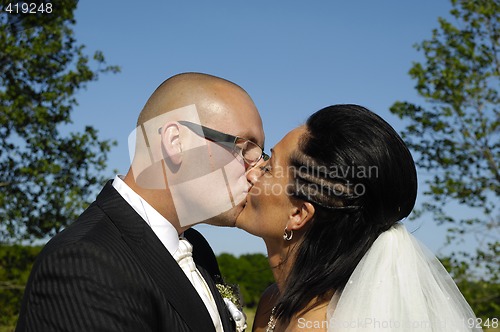 Image of Wedding couple kissing