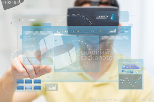 Image of young man in virtual reality headset or 3d glasses