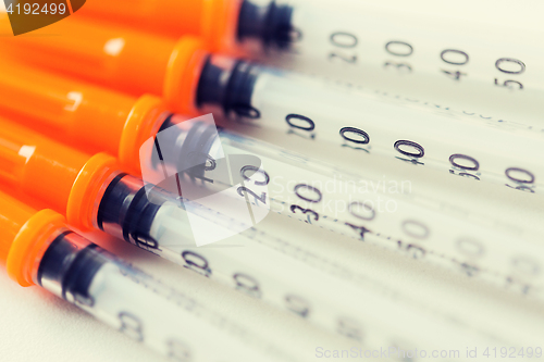 Image of close up of insulin syringes on table