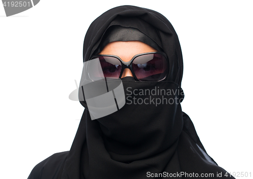 Image of muslim woman in hijab and sunglasses over white