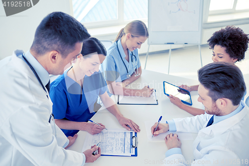 Image of group of happy doctors meeting at hospital office