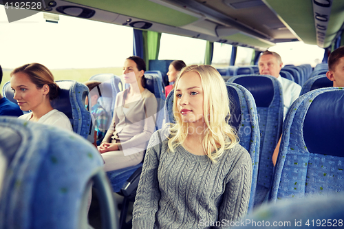 Image of group of passengers or tourists in travel bus