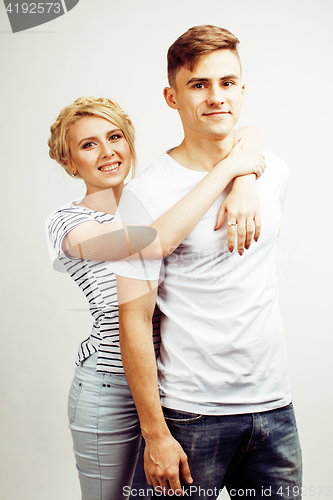 Image of young pretty teenage couple, hipster guy with his girlfriend happy smiling and hugging isolated on white background, lifestyle people concept