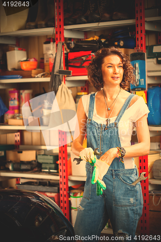 Image of car mechanic a beautiful woman