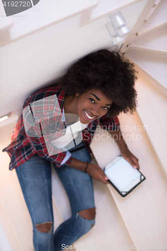 Image of black woman using her electronic tablet