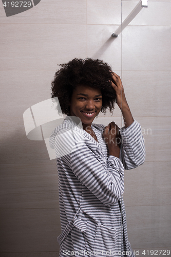 Image of beautiful black woman wearing  bathrobe