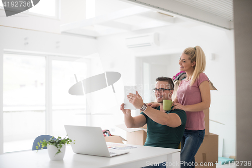 Image of Young couple moving in a new home