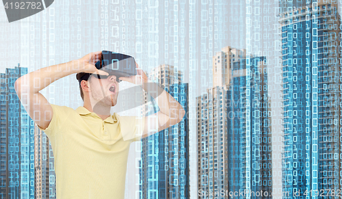 Image of happy man in virtual reality headset or 3d glasses