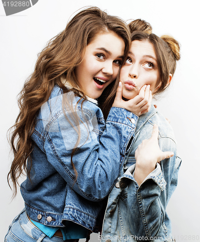 Image of best friends teenage girls together having fun, posing emotional on white background, besties happy smiling, lifestyle people concept close up