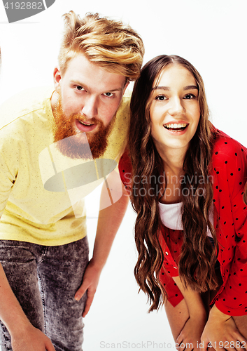 Image of young pretty teenage couple, hipster guy with his girlfriend happy smiling and hugging isolated on white background, lifestyle people concept 