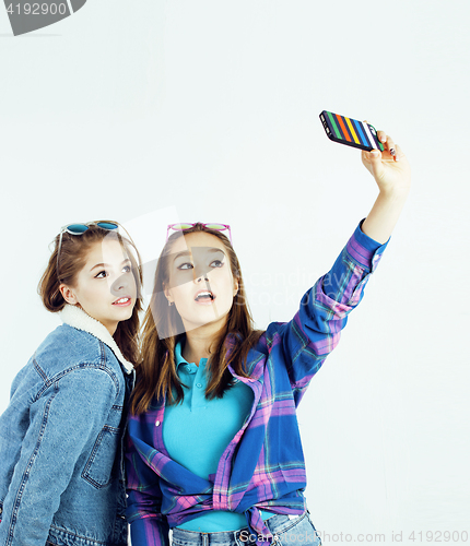 Image of best friends teenage girls together having fun, posing emotional on white background, besties happy smiling, lifestyle people concept close up