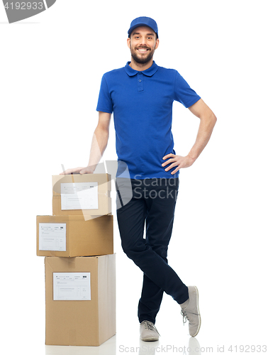 Image of happy delivery man with parcel boxes