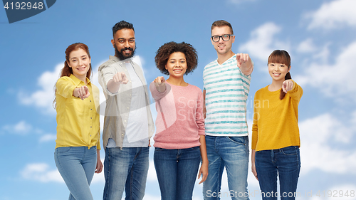 Image of international group of people pointing on you