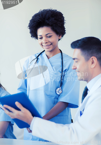 Image of happy doctors meeting at hospital office