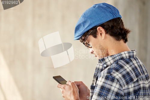 Image of close up of man texting message on smartphone