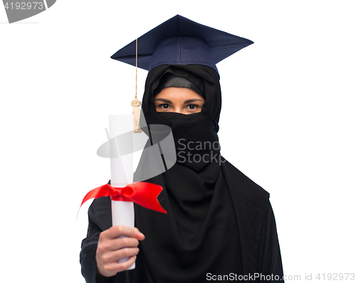 Image of muslim woman in hijab and mortarboard with diploma