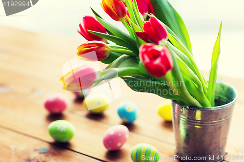 Image of close up of easter eggs and flowers in bucket