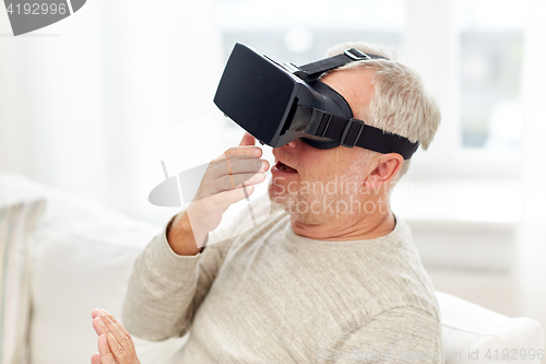 Image of old man in virtual reality headset or 3d glasses