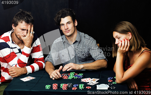 Image of young people playing poker off-line tournament, friends party concept at home