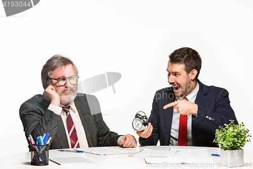 Image of The two colleagues working together at office on white background.