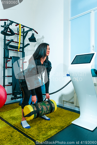 Image of The female athlete doing they exercise in a ems fitness studio