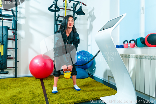 Image of The female athlete doing they exercise in a ems fitness studio