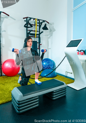 Image of The female athlete doing they exercise in a ems fitness studio