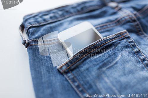 Image of smartphone in pocket of denim pants or jeans