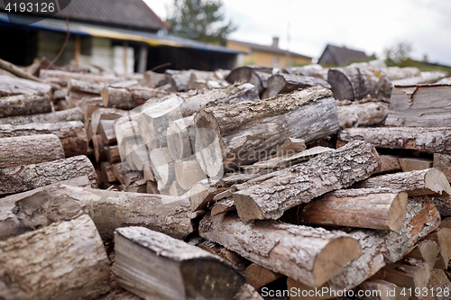 Image of stack of firewood on farm at country