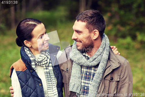 Image of happy couple hugging at camp in woods