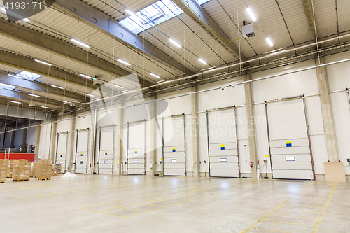 Image of warehouse doors or gates and cargo boxes