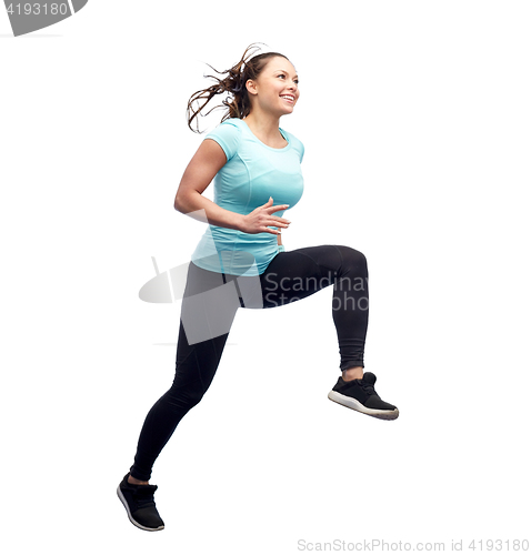 Image of happy smiling sporty young woman jumping in air