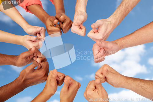 Image of hands of international people showing thumbs up