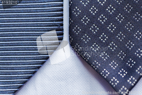 Image of close up of blue patterned ties