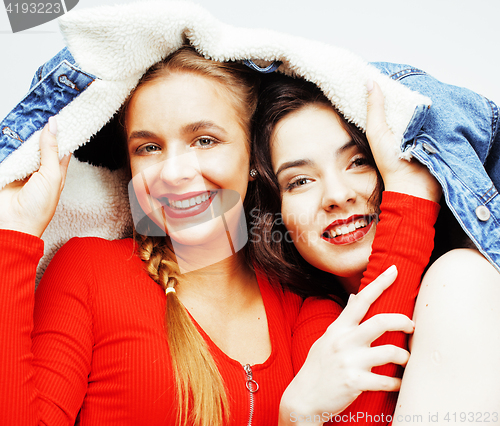 Image of best friends teenage girls together having fun, posing emotional on white background, besties happy smiling, lifestyle people concept close up