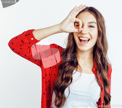 Image of young pretty teenage hipster girl posing emotional happy smiling on white background, lifestyle people concept 