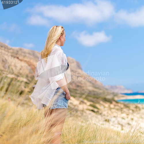 Image of Free Happy Woman Enjoying Sun on Vacations.