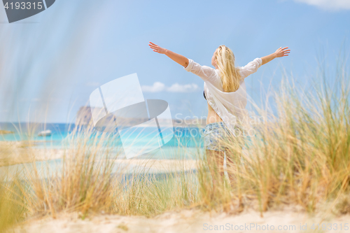 Image of Free Happy Woman Enjoying Sun on Vacations.