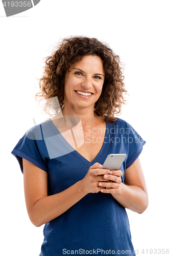 Image of Happy woman texting