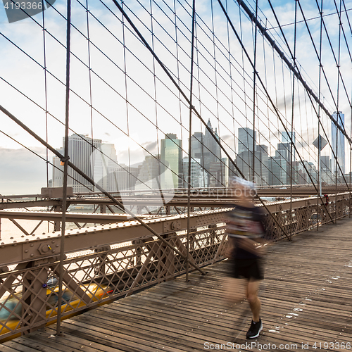 Image of Brooklyn bridge at sunset, New York City.