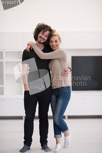 Image of couple hugging in their new home